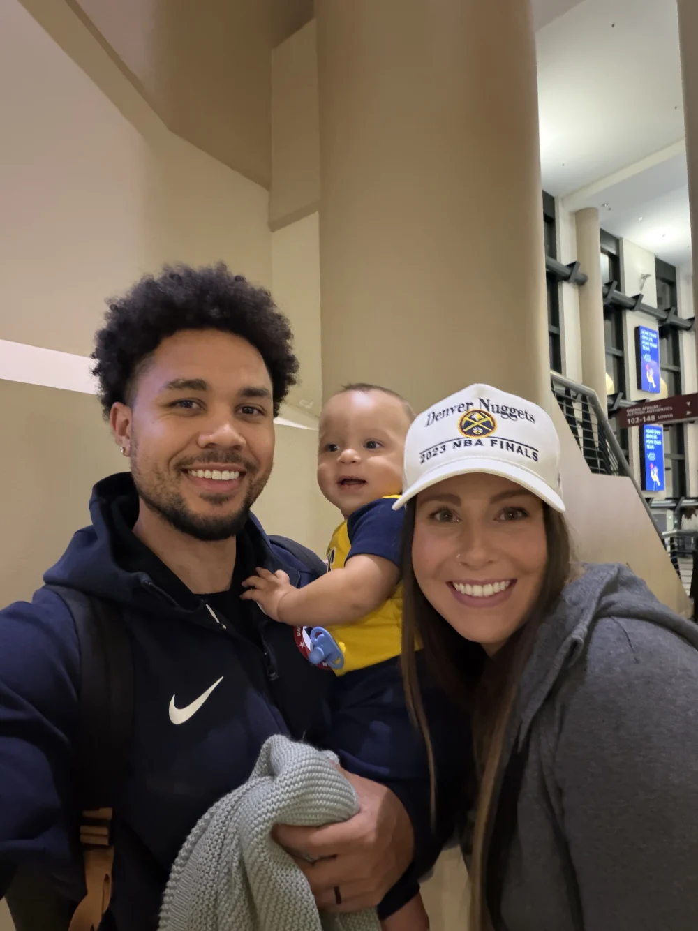 Mike and his family at a Denver Nuggets game